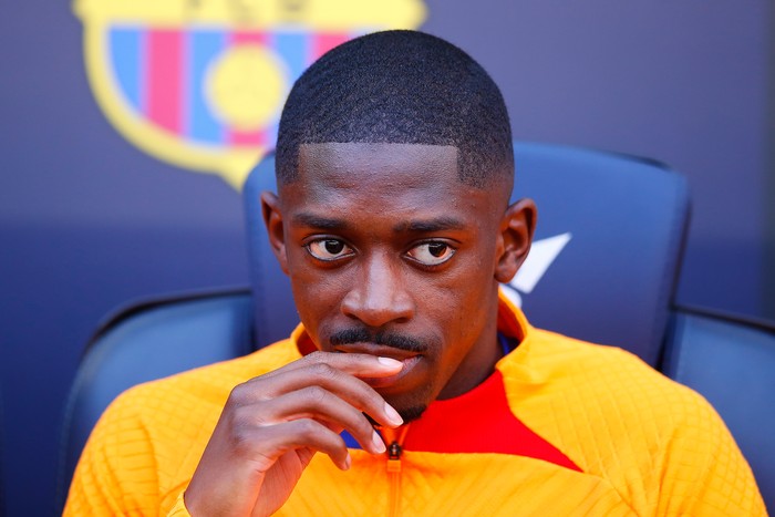 BARCELONA, SPAIN - FEBRUARY 06: Ousmane Dembele of FC Barcelona looks on in the bench prior the LaLiga Santander match between FC Barcelona and Club Atletico de Madrid at Camp Nou on February 06, 2022 in Barcelona, Spain. (Photo by Eric Alonso/Getty Images)
