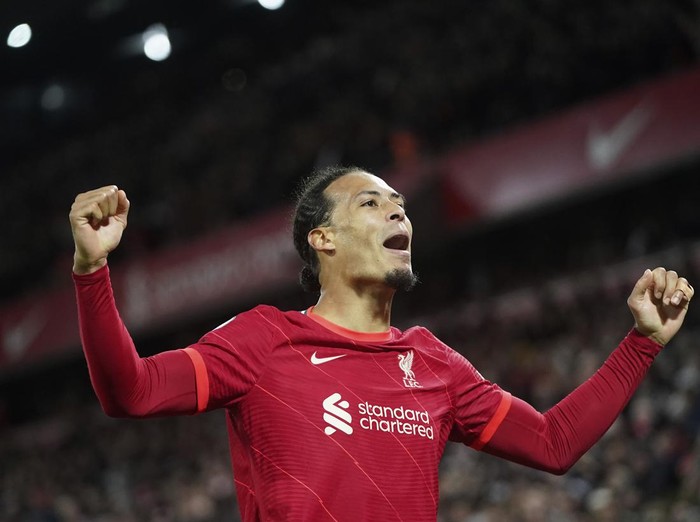 Liverpool's Virgil van Dijk celebrates after scoring against Leeds United during the English Premier League soccer match between Liverpool and Leeds United at Anfield stadium in Liverpool, England, Wednesday, Feb. 23, 2022. (AP Photo/Jon Super)