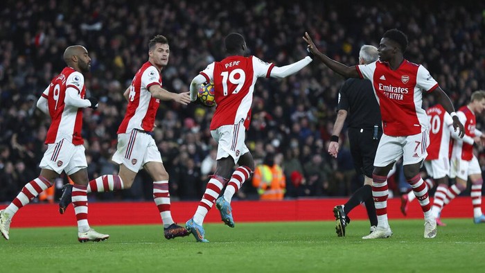 Arsenals Nicolas Pepe celebrates after scoring his sides first goal during the English Premier League soccer match between Arsenal and Wolverhampton Wanderers at the Emirates Stadium, London, Thursday, Feb. 24, 2022. (AP Photo/Ian Walton)