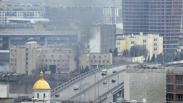 Smoke and flame rise near a military building after an apparent Russian strike in Kyiv, Ukraine, Thursday, Feb. 24, 2022. Russian troops have launched their anticipated attack on Ukraine. Big explosions were heard before dawn in Kyiv, Kharkiv and Odesa as world leaders decried the start of an Russian invasion that could cause massive casualties and topple Ukraines democratically elected government. (AP Photo/Efrem Lukatsky)