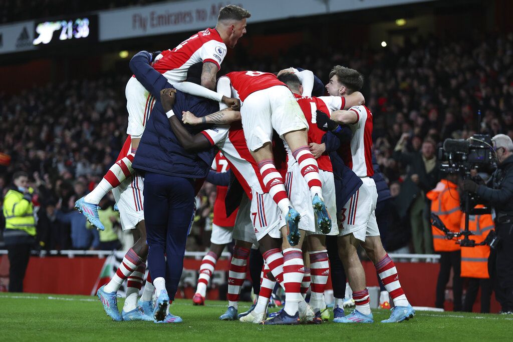 Wolverhampton Wanderers' Nelson Semedo, right, and Arsenal's Martin Odegaard vie for the ball during the English Premier League soccer match between Arsenal and Wolverhampton Wanderers at the Emirates Stadium, London, Thursday, Feb. 24, 2022. (AP Photo/Ian Walton)