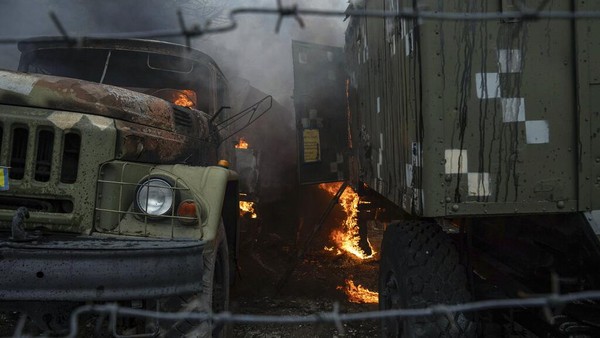 Ukrainian military track burns at an air defence base in the aftermath of an apparent Russian strike in Mariupol, Ukraine, Thursday, Feb. 24, 2022. Russian troops have launched their anticipated attack on Ukraine. Big explosions were heard before dawn in Kyiv, Kharkiv and Odesa as world leaders decried the start of Russian invasion that could cause massive casualties and topple Ukraines democratically elected government. (AP Photo/Evgeniy Maloletka)