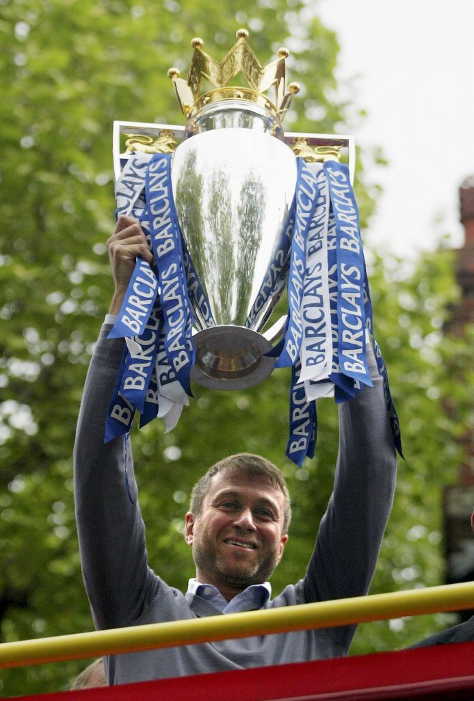 LONDON - MAY 14:  Chelsea owner, Roman Abramovich shows the Premiership Trophy to the fans on the open-topped bus parade of the Barclays Premiership trophy and the FA Community Shield as they make their way down New King's Road on the Chelsea Football Club victory parade on May 14, 2006 in London, England.  Chelsea became only the second club to win back to back Premiership Titles gaining manager Jose Mourinho his second title in two years. (Photo by Dean Mouhtaropoulos/Getty Images)