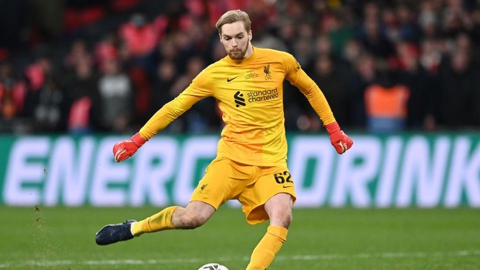 LONDON, ENGLAND - FEBRUARY 27: Caoimhin Kelleher of Liverpool scores their teams eleventh penalty in the penalty shoot out during the Carabao Cup Final match between Chelsea and Liverpool at Wembley Stadium on February 27, 2022 in London, England. (Photo by Shaun Botterill/Getty Images)