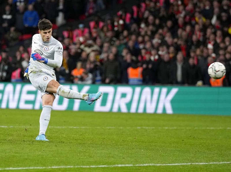 Chelsea's goalkeeper Kepa Arrizabalaga fails to score a penalty during a penalty shootout after the match ended tied 0-0 during the English League Cup final soccer match between Chelsea and Liverpool at Wembley stadium in London, Sunday, Feb. 27, 2022. Liverpool won the penalty shootout 11-10. (AP Photo/Alastair Grant)