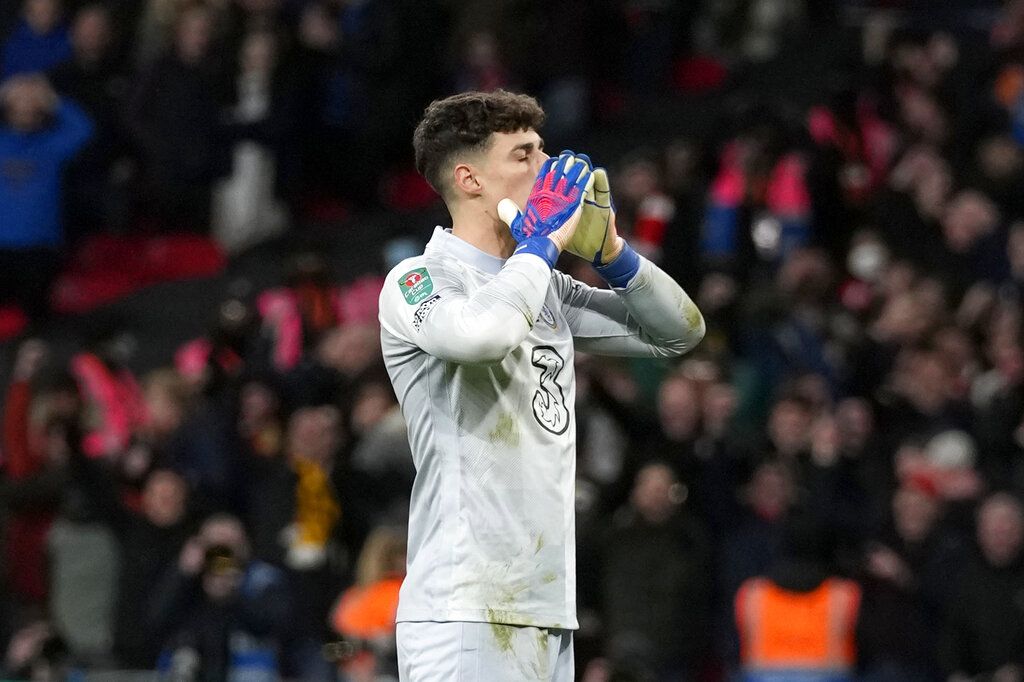 Chelsea's goalkeeper Kepa Arrizabalaga reacts after failing to score a penalty during a penalty shootout after the match ended tied 0-0 during the English League Cup final soccer match between Chelsea and Liverpool at Wembley stadium in London, Sunday, Feb. 27, 2022. Liverpool won the penalty shootout 11-10. (AP Photo/Alastair Grant)