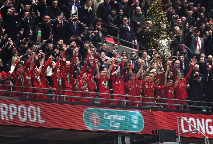 LONDON, ENGLAND - FEBRUARY 27: Jordan Henderson of Liverpool lifts the Carabao Cup trophy following victory in the Carabao Cup Final match between Chelsea and Liverpool at Wembley Stadium on February 27, 2022 in London, England. (Photo by Michael Regan/Getty Images)