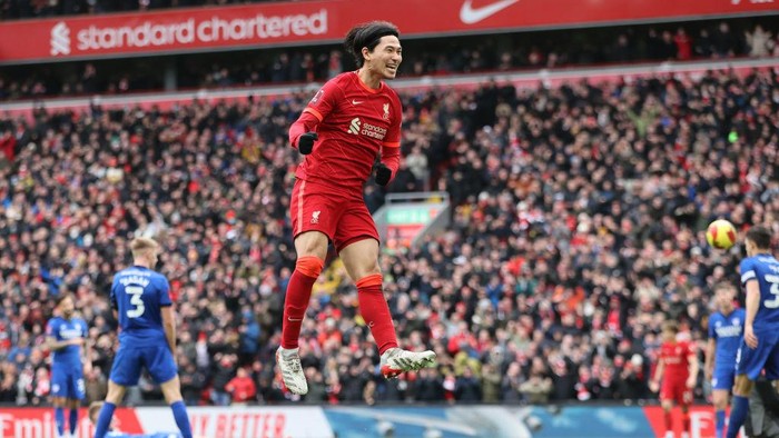 LIVERPOOL, ENGLAND - FEBRUARY 06: Liverpool player Takumi Minamino celebrates after scoring the second Liverpool goal during the Emirates FA Cup Fourth Round match between Liverpool and Cardiff City at Anfield on February 06, 2022 in Liverpool, England. (Photo by Clive Brunskill/Getty Images)