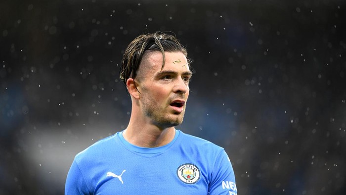 MANCHESTER, ENGLAND - FEBRUARY 05: Jack Grealish of Manchester City looks on during the Emirates FA Cup Fourth Round match between Manchester City and Fulham at Etihad Stadium on February 05, 2022 in Liverpool, England. (Photo by Clive Mason/Getty Images)