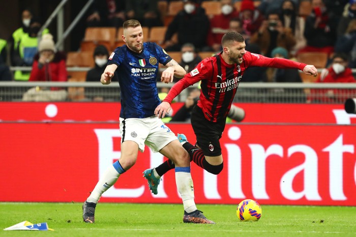MILAN, ITALY - MARCH 01: Milan Skriniar of FC Internazionale challenges Ante Rebic of AC Milan during the Coppa Italia Semi Final 1st Leg match between AC Milan and FC Internazionale at Stadio Giuseppe Meazza on March 01, 2022 in Milan, Italy. (Photo by Marco Luzzani/Getty Images)