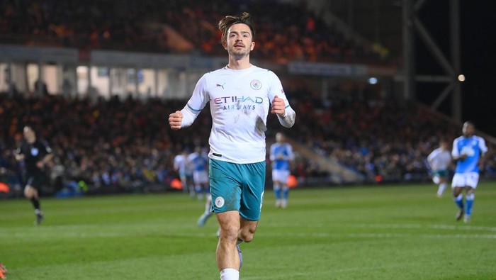PETERBOROUGH, ENGLAND - MARCH 01: Jack Grealish of Manchester City celebrates after scoring their teams second goal during the Emirates FA Cup Fifth Round match between Peterborough United and Manchester City at ABAX Stadium on March 01, 2022 in Peterborough, England. (Photo by Laurence Griffiths/Getty Images)
