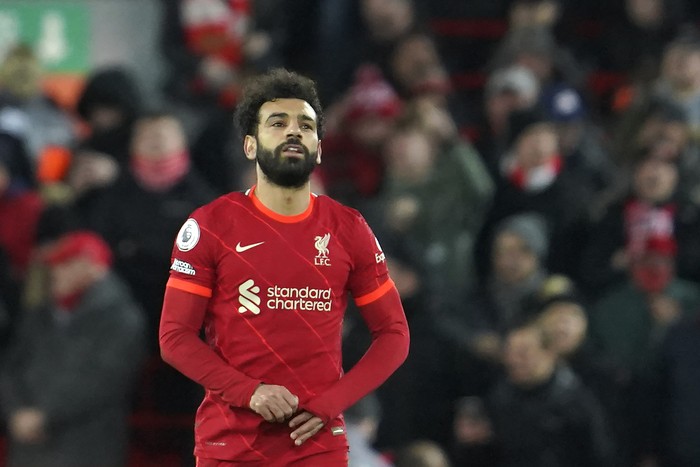 Liverpool's Mohamed Salah, right, celebrates after scores his second goal against Leeds United during the English Premier League soccer match between Liverpool and Leeds United at Anfield stadium in Liverpool, England, Wednesday, Feb. 23, 2022. (AP Photo/Jon Super)