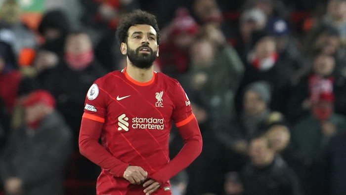 Liverpools Mohamed Salah, right, celebrates after scores his second goal against Leeds United during the English Premier League soccer match between Liverpool and Leeds United at Anfield stadium in Liverpool, England, Wednesday, Feb. 23, 2022. (AP Photo/Jon Super)