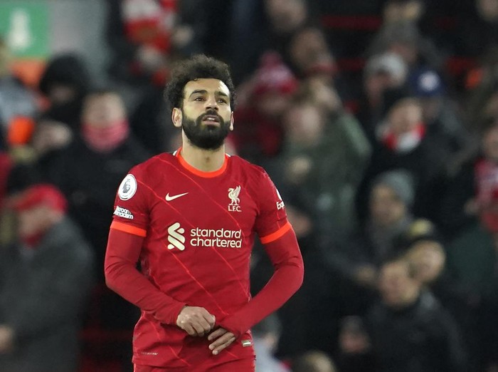 Liverpool's Mohamed Salah, right, celebrates after scores his second goal against Leeds United during the English Premier League soccer match between Liverpool and Leeds United at Anfield stadium in Liverpool, England, Wednesday, Feb. 23, 2022. (AP Photo/Jon Super)