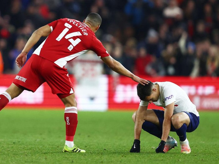 MIDDLESBROUGH, ENGLAND - MARCH 01: Sergio Reguilon of Tottenham Hotspur is embraced by Lee Peltier of Middlesbrough after the Emirates FA Cup Fifth Round match between Middlesbrough and Tottenham Hotspur at Riverside Stadium on March 01, 2022 in Middlesbrough, England. (Photo by Clive Brunskill/Getty Images)