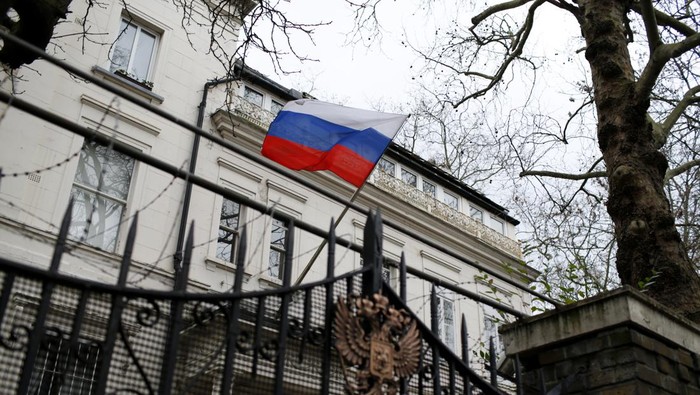 A Russian flag flies outside the Consular Section of the Russian Embassy in London, Tuesday, Feb. 22, 2022. British Prime Minister Boris Johnson says the U.K. will introduce 