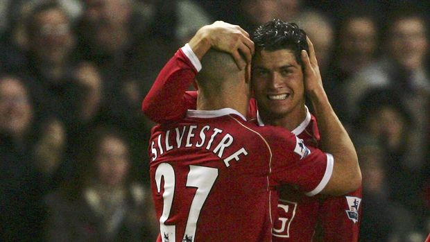 MANCHESTER, UNITED KINGDOM - DECEMBER 30:  Cristiano Ronaldo (R) of Manchester United celebrates scoring his team's second goal with team mate Mikael Silvestre during the Barclays Premiership match between Manchester United and Reading at Old Trafford on December 30, 2006 in Manchester, England.  (Photo by Alex Livesey/Getty Images)