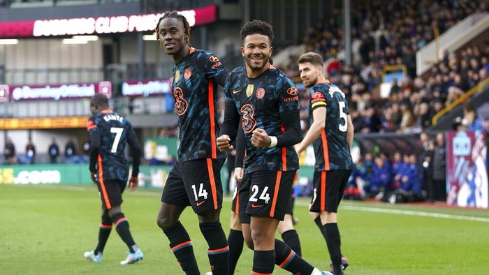 Chelseas Reece James, center, celebrates scoring their sides first goal of the game during the English Premier League soccer match between Burnley and Chelsea at Turf Moor, Burnley, England, Saturday, March 5, 2022. (Martin Rickett/PA via AP)