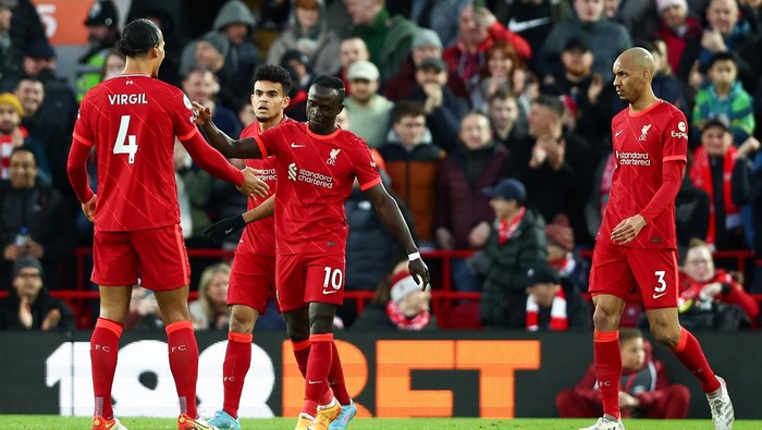 LIVERPOOL, ENGLAND - MARCH 05: Sadio Mane celebrates with Virgil van Dijk of Liverpool after scoring their teams first goal during the Premier League match between Liverpool and West Ham United at Anfield on March 05, 2022 in Liverpool, England. (Photo by Clive Brunskill/Getty Images)