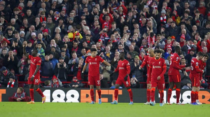 Liverpools Sadio Mane, left, celebrates with teammates after scoring his sides first goal during the English Premier League soccer match between Liverpool and West Ham United at Anfield stadium in Liverpool, England, Saturday, March 5, 2022. (AP Photo/Jon Super)