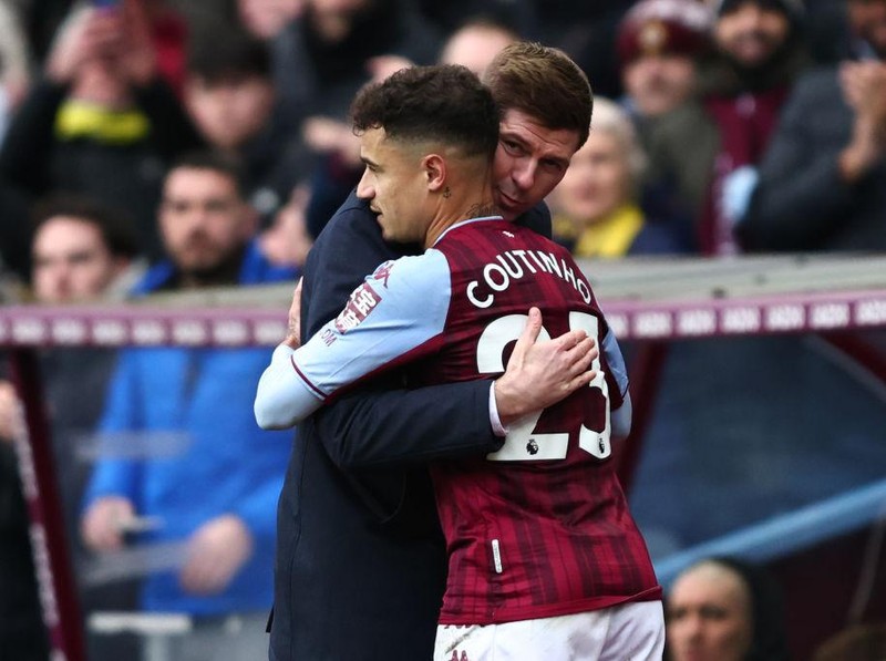 BIRMINGHAM, ENGLAND - MARCH 05:  Aston Villa manager Steven Gerrard embraces Philippe Coutinho during the Premier League match between Aston Villa and Southampton at Villa Park on March 5, 2022 in Birmingham, United Kingdom. (Photo by Marc Atkins/Getty Images)