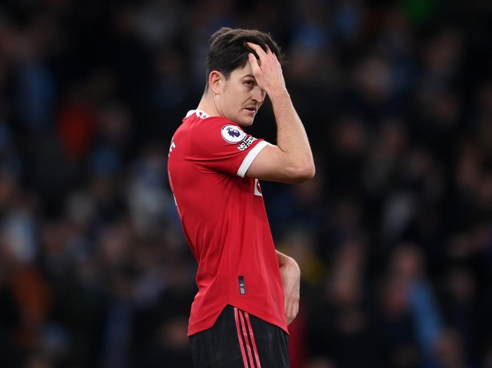 MANCHESTER, ENGLAND - MARCH 06: Harry Maguire of Manchester United looks dejected during the Premier League match between Manchester City and Manchester United at Etihad Stadium on March 06, 2022 in Manchester, England. (Photo by Laurence Griffiths/Getty Images)
