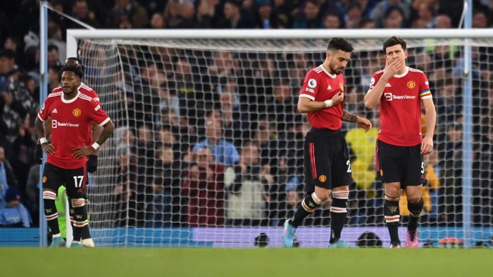 MANCHESTER, ENGLAND - MARCH 06: Harry Maguire of Manchester United looks dejected after Riyad Mahrez of Manchester City scores their sides third goal during the Premier League match between Manchester City and Manchester United at Etihad Stadium on March 06, 2022 in Manchester, England. (Photo by Michael Regan/Getty Images)