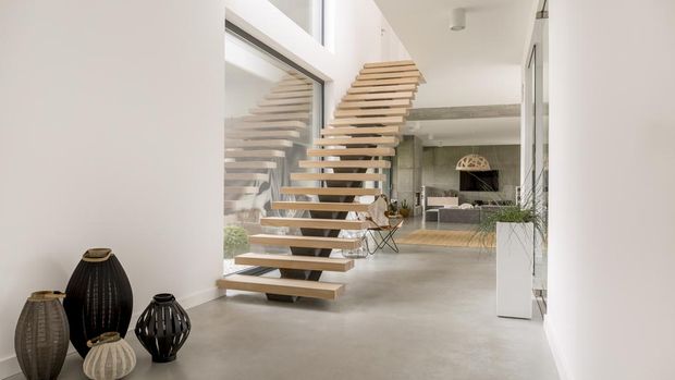 Wooden minimalistic stairs in pure big space