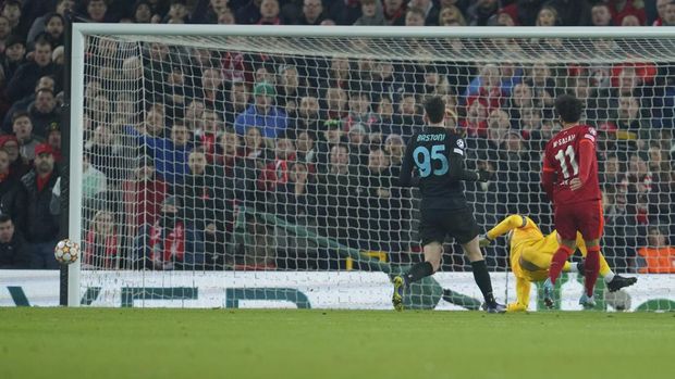 The ball hits a post after Liverpool's Mohamed Salah, right, shots on target during the Champions League, round of 16, second leg soccer match between Liverpool and Inter Milan at Anfield stadium in Liverpool, England, Tuesday, March 8, 2022. (AP Photo/Jon Super)