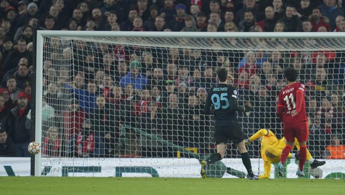 The ball hits a post after Liverpools Mohamed Salah, right, shots on target during the Champions League, round of 16, second leg soccer match between Liverpool and Inter Milan at Anfield stadium in Liverpool, England, Tuesday, March 8, 2022. (AP Photo/Jon Super)