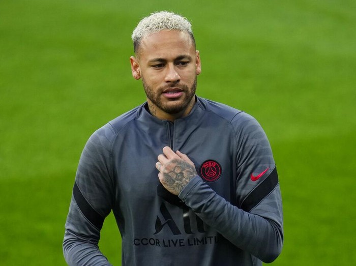 PSG's Lionel Messi, second left, and Neymar, right, attend a training session with teammates at the Bernabeu stadium in Madrid, Spain, Tuesday, March 8, 2022. Real Madrid will play its Champions League soccer match against Paris Saint-Germain on Wednesday. (AP Photo/Manu Fernandez)