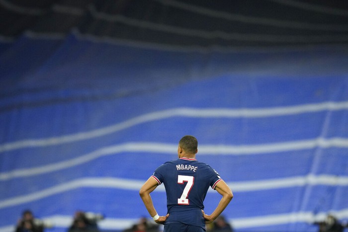 PSGs Kylian Mbappe reacts after Real Madrid scored their sides third goal during the Champions League, round of 16, second leg soccer match between Real Madrid and Paris Saint-Germain at the Santiago Bernabeu stadium in Madrid, Spain, Wednesday, March 9, 2022. (AP Photo/Manu Fernandez)