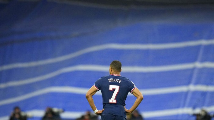 PSGs Kylian Mbappe reacts after Real Madrid scored their sides third goal during the Champions League, round of 16, second leg soccer match between Real Madrid and Paris Saint-Germain at the Santiago Bernabeu stadium in Madrid, Spain, Wednesday, March 9, 2022. (AP Photo/Manu Fernandez)