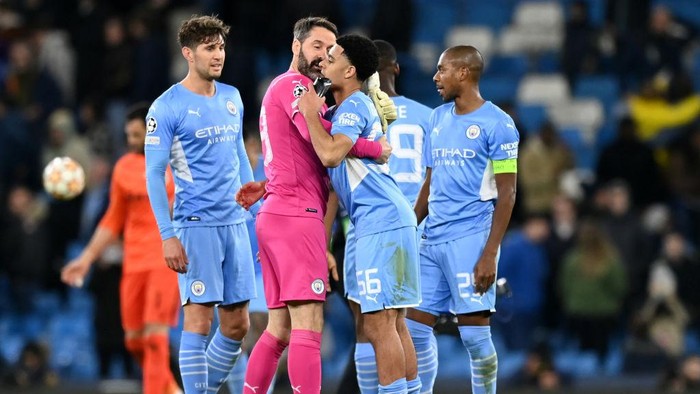MANCHESTER, ENGLAND - MARCH 09: Scott Carson and CJ Egan-Riley of Manchester City celebrate following the UEFA Champions League Round Of Sixteen Leg Two match between Manchester City and Sporting CP at City of Manchester Stadium on March 09, 2022 in Manchester, England. (Photo by Shaun Botterill/Getty Images)