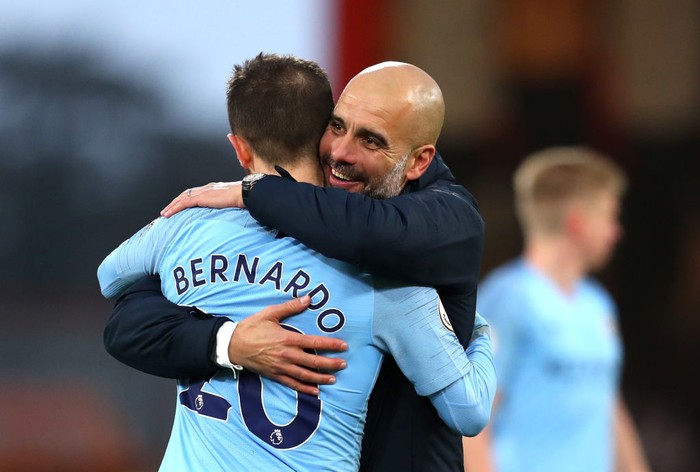 BOURNEMOUTH, ENGLAND - MARCH 02: Josep Guardiola, Manager of Manchester City embraces Bernardo Silva of Manchester City following the Premier League match between AFC Bournemouth and Manchester City at Vitality Stadium on March 02, 2019 in Bournemouth, United Kingdom. (Photo by Catherine Ivill/Getty Images)