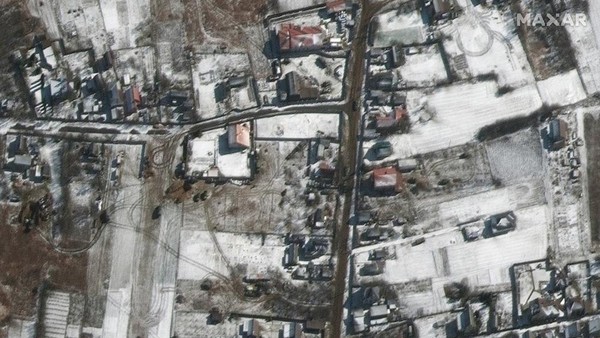 This satellite image provided by Maxar Technologies shows troops and military vehicles deployed in Ozera, Ukraine, northeast of Antonov Airport, during the Russian invasion, Thursday, March 10, 2022. (Satellite image ©2022 Maxar Technologies via AP)