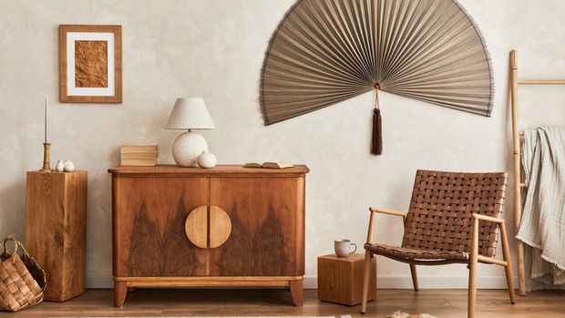Interior design of neutral living room with stylish retro commode, mock up poster frame, cube, table lamp, decoration and elegant personal accessories in home decor. Template. Japandi concept.