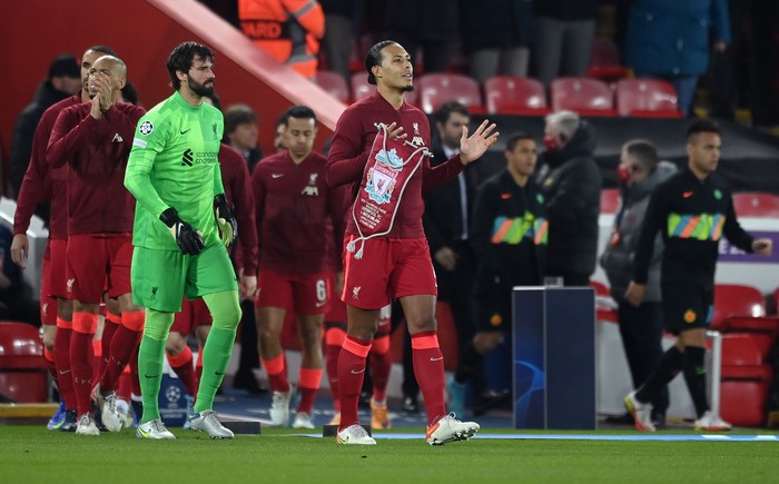 LIVERPOOL, ENGLAND - MARCH 08: Captain of Liverpool Virgil Van Dijk leads the team out before the UEFA Champions League Round Of Sixteen Leg Two match between Liverpool FC and FC Internazionale at Anfield on March 08, 2022 in Liverpool, England. (Photo by Michael Regan/Getty Images)