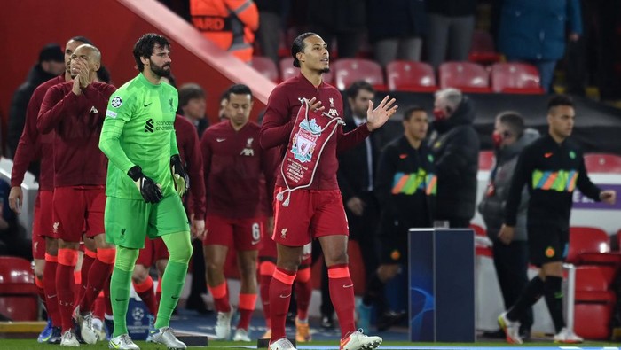 LIVERPOOL, ENGLAND - MARCH 08: Captain of Liverpool Virgil Van Dijk leads the team out before the UEFA Champions League Round Of Sixteen Leg Two match between Liverpool FC and FC Internazionale at Anfield on March 08, 2022 in Liverpool, England. (Photo by Michael Regan/Getty Images)