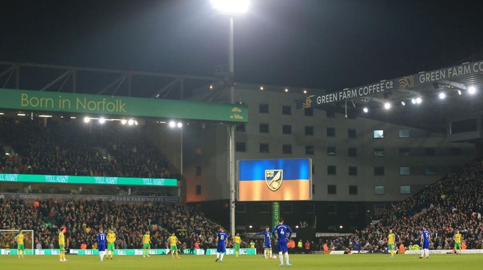 NORWICH, ENGLAND - MARCH 10: The LED screen inside the stadium shows a Ukrainian flag to indicate peace and sympathy with Ukraine during the Premier League match between Norwich City and Chelsea at Carrow Road on March 10, 2022 in Norwich, England. (Photo by Stephen Pond/Getty Images)