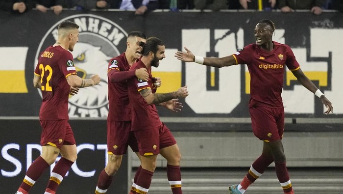 Teammates celebrate with Romas Sergio Oliveira, center, who scored his sides first goal during the round of sixteen, first leg Conference League soccer match between Vitesse and AS Roma at Gelredome stadium in Arnhem, Netherlands, Thursday, March 10, 2022. (AP Photo/Peter Dejong)