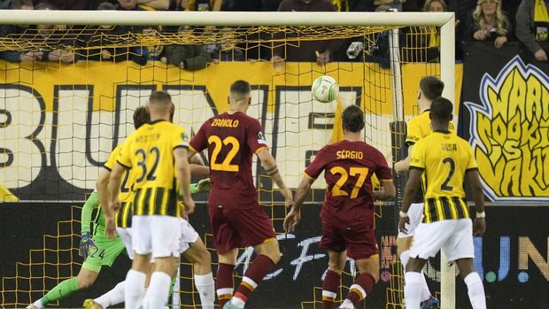 Teammates celebrate with Roma's Sergio Oliveira, center, who scored his side's first goal during the round of sixteen, first leg Conference League soccer match between Vitesse and AS Roma at Gelredome stadium in Arnhem, Netherlands, Thursday, March 10, 2022. (AP Photo/Peter Dejong)