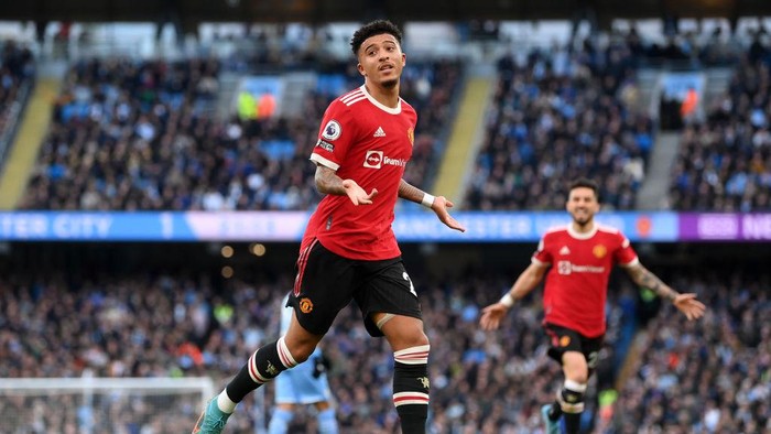 MANCHESTER, ENGLAND - MARCH 06: Jadon Sancho of Manchester United celebrates after scoring their sides first goal during the Premier League match between Manchester City and Manchester United at Etihad Stadium on March 06, 2022 in Manchester, England. (Photo by Laurence Griffiths/Getty Images)
