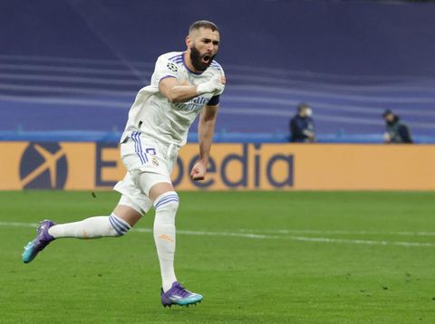 MADRID, SPAIN - MARCH 09: Karim Benzema of Real Madrid CF celebrates scoring their opening goal during the UEFA Champions League Round Of Sixteen Leg Two match between Real Madrid and Paris Saint-Germain at Estadio Santiago Bernabeu on March 09, 2022 in Madrid, Spain. (Photo by Gonzalo Arroyo Moreno/Getty Images)