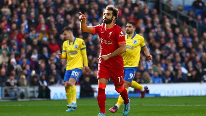 BRIGHTON, ENGLAND - MARCH 12: Mohamed Salah of Liverpool celebrates after scoring their teams second goal from the penalty spot during the Premier League match between Brighton & Hove Albion and Liverpool at American Express Community Stadium on March 12, 2022 in Brighton, England. (Photo by Bryn Lennon/Getty Images)