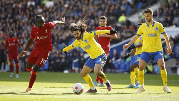Soccer Football - Premier League - Brighton & Hove Albion v Liverpool - The American Express Community Stadium, Brighton, Britain - March 12, 2022 Brighton & Hove Albion's Marc Cucurella in action with Liverpool's Sadio Mane Action Images via Reuters/John Sibley EDITORIAL USE ONLY. No use with unauthorized audio, video, data, fixture lists, club/league logos or 'live' services. Online in-match use limited to 75 images, no video emulation. No use in betting, games or single club /league/player publications.  Please contact your account representative for further details.