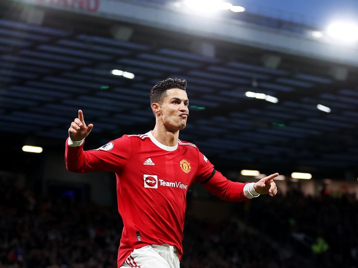 MANCHESTER, ENGLAND - MARCH 12: Cristiano Ronaldo of Manchester United celebrates after scoring their side's second goal during the Premier League match between Manchester United and Tottenham Hotspur at Old Trafford on March 12, 2022 in Manchester, England. (Photo by Naomi Baker/Getty Images)