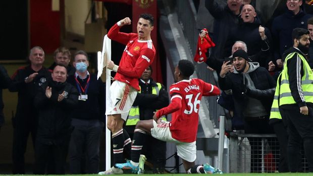 MANCHESTER, ENGLAND - MARCH 12: Cristiano Ronaldo of Manchester United celebrates after scoring their side's third goal during the Premier League match between Manchester United and Tottenham Hotspur at Old Trafford on March 12, 2022 in Manchester, England. (Photo by Naomi Baker/Getty Images)