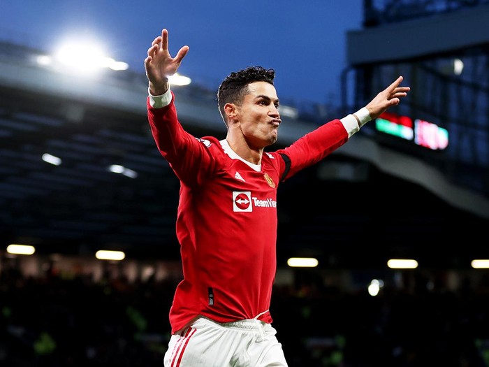 MANCHESTER, ENGLAND - MARCH 12: Cristiano Ronaldo of Manchester United celebrates after scoring their side's second goal during the Premier League match between Manchester United and Tottenham Hotspur at Old Trafford on March 12, 2022 in Manchester, England. (Photo by Naomi Baker/Getty Images)