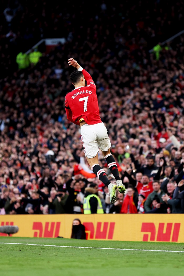 MANCHESTER, ENGLAND - MARCH 12: Cristiano Ronaldo of Manchester United celebrates after scoring their side's first goal during the Premier League match between Manchester United and Tottenham Hotspur at Old Trafford on March 12, 2022 in Manchester, England. (Photo by Naomi Baker/Getty Images)